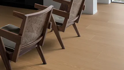 Stylish Coretec WPC flooring for contemporary spaces Coretec Residential WPC flooring in a modern living room with wooden chairs