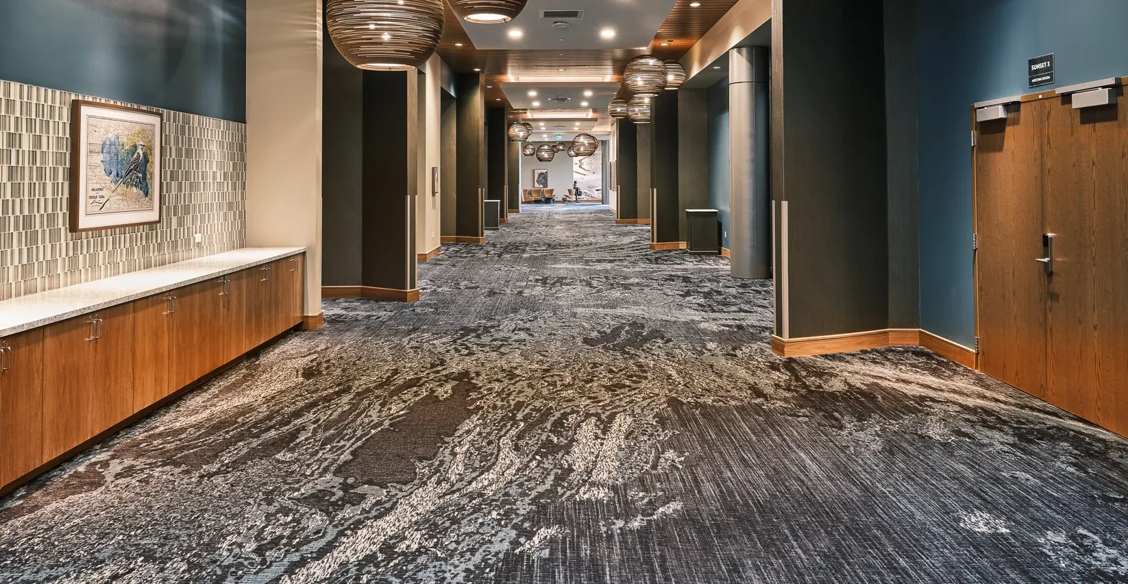 Modern hallway with patterned carpet flooring