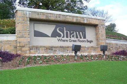 Shaw Floors Entrance Sign - Where Great Floors Begin Shaw Floors entrance sign with stone wall and landscaping