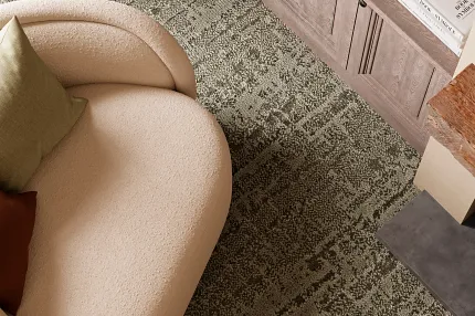 Beige armchair and textured carpet in living room scene Modern living room with beige armchair and textured carpet flooring