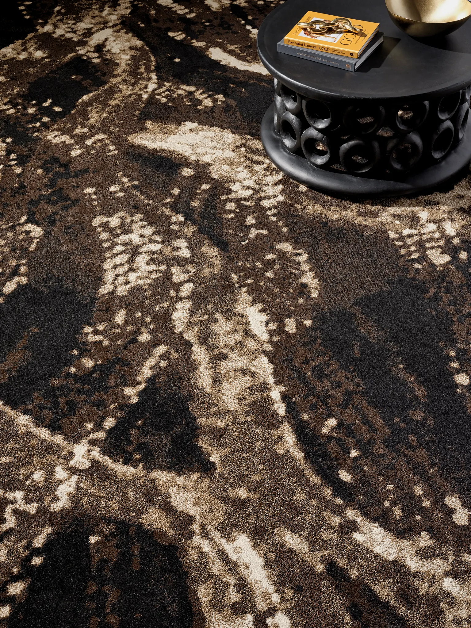Abstract patterned carpet in shades of brown and beige with a modern coffee table