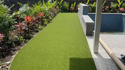 Lush synthetic turf for outdoor spaces Green artificial grass in a sunny backyard garden