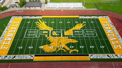 Ferndale Eagles Artificial Turf Football Field Aerial view of Ferndale Eagles football field with artificial turf featuring yellow eagle design and track surrounding the field