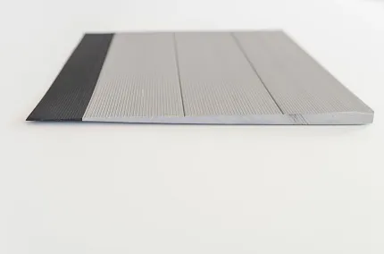 Black and Gray Ribbed Commercial Flooring Swatch Close-up view of a commercial flooring swatch featuring black and gray tones with a ribbed texture