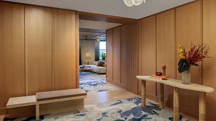 Contemporary interior with stylish carpet and wood accents Modern hallway with abstract carpet design and wooden paneling