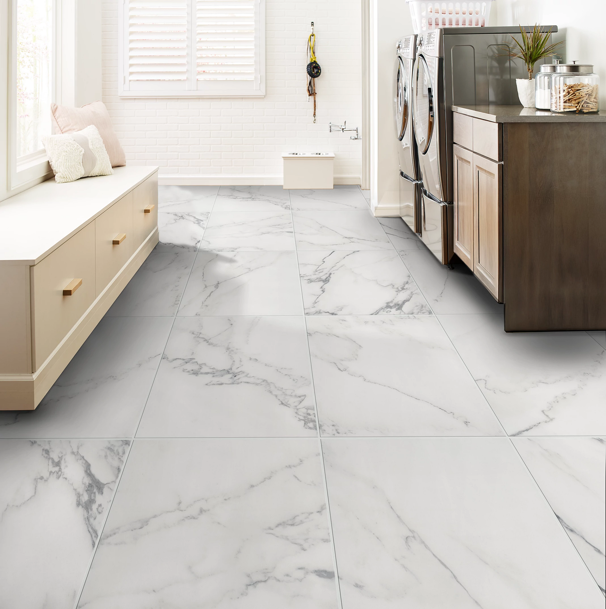 Laundry room with Marble-look tile flooring 