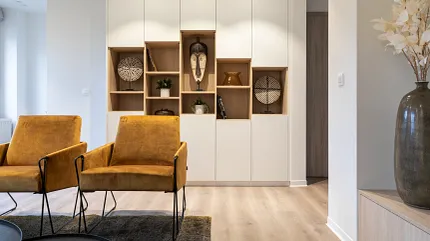 Light Wood Look Luxury Vinyl Plank Flooring in Modern Living Room Modern living room with light wood look luxury vinyl plank flooring and mustard yellow chairs