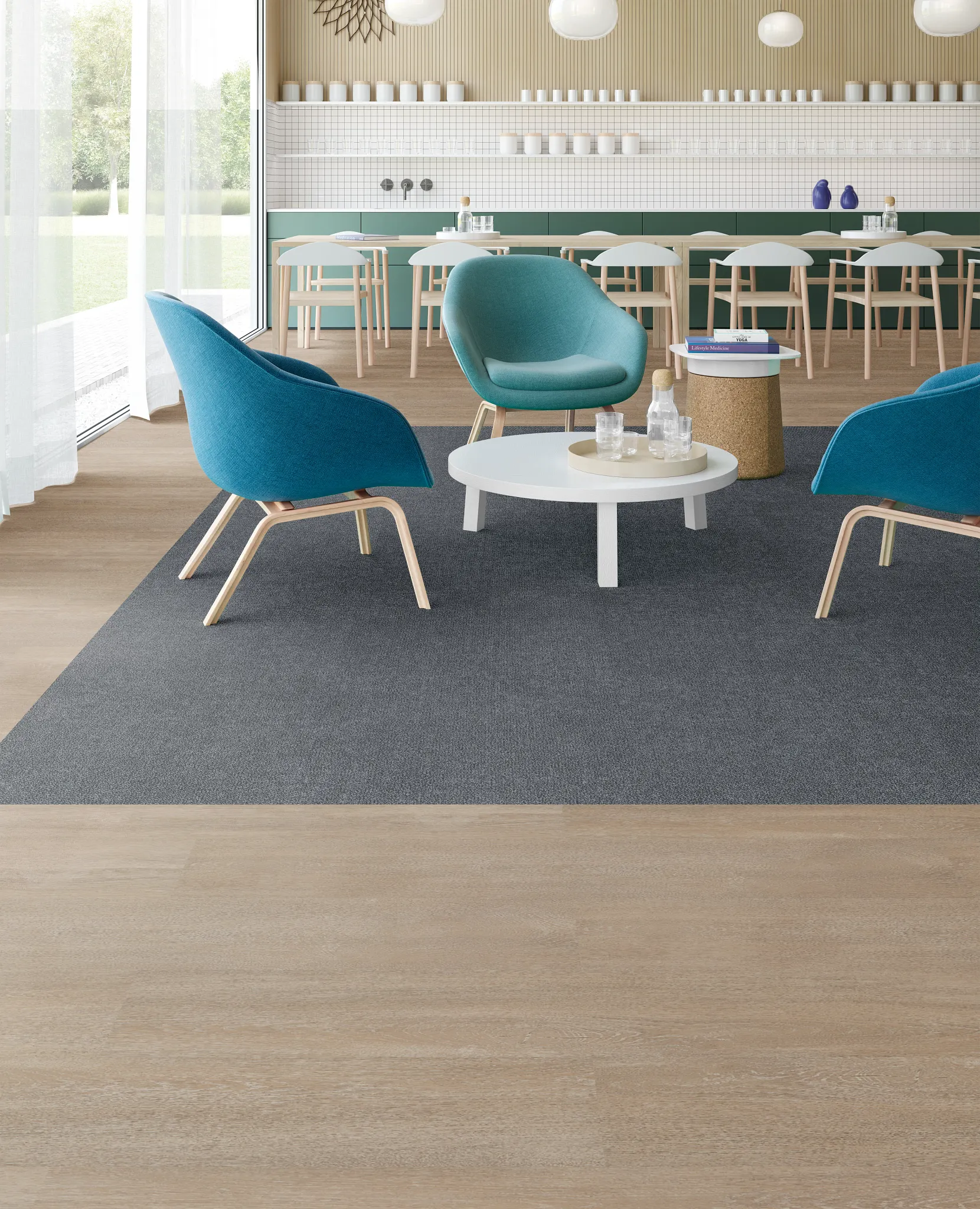 Modern education facility with teal chairs and light wood flooring