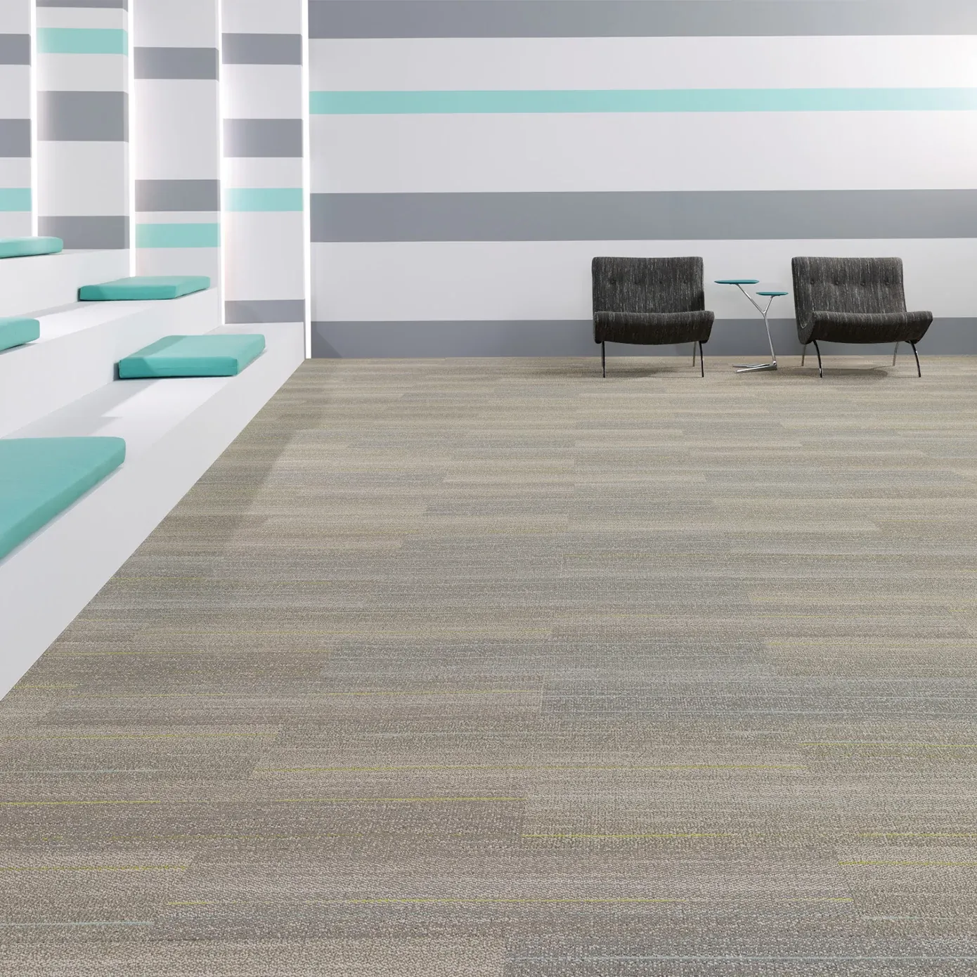 Modern education facility with commercial carpet tile flooring in neutral tones, featuring teal and gray striped walls and seating area with two black