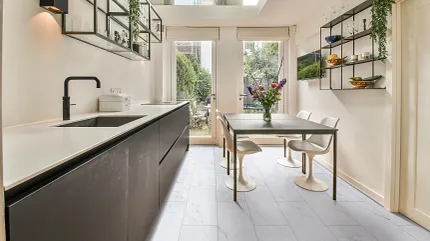 Coretec Residential WPC Luxury Vinyl Tile Flooring in Modern Kitchen Modern kitchen with Coretec Residential WPC luxury vinyl tile flooring in a light stone look, featuring dimensions of 24.02x12.01 inches