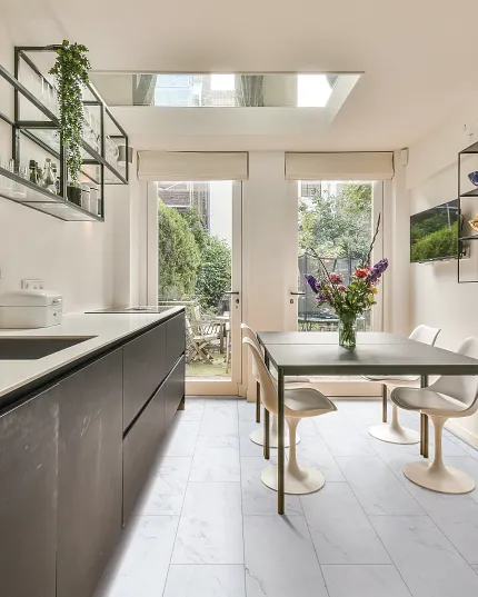 Coretec Residential WPC Luxury Vinyl Tile Flooring in Modern Kitchen Modern kitchen with Coretec Residential WPC luxury vinyl tile flooring in a light stone look, featuring dimensions of 24.02x12.01 inches