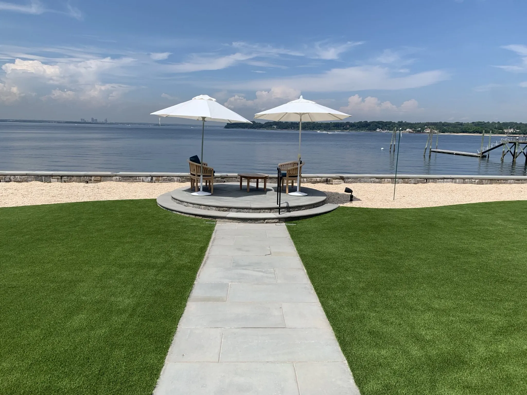 Scenic outdoor patio with umbrellas by the waterfront