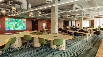 Education Facility with Green Commercial Carpet Tile Flooring Modern education facility with green carpet tiles and contemporary furniture