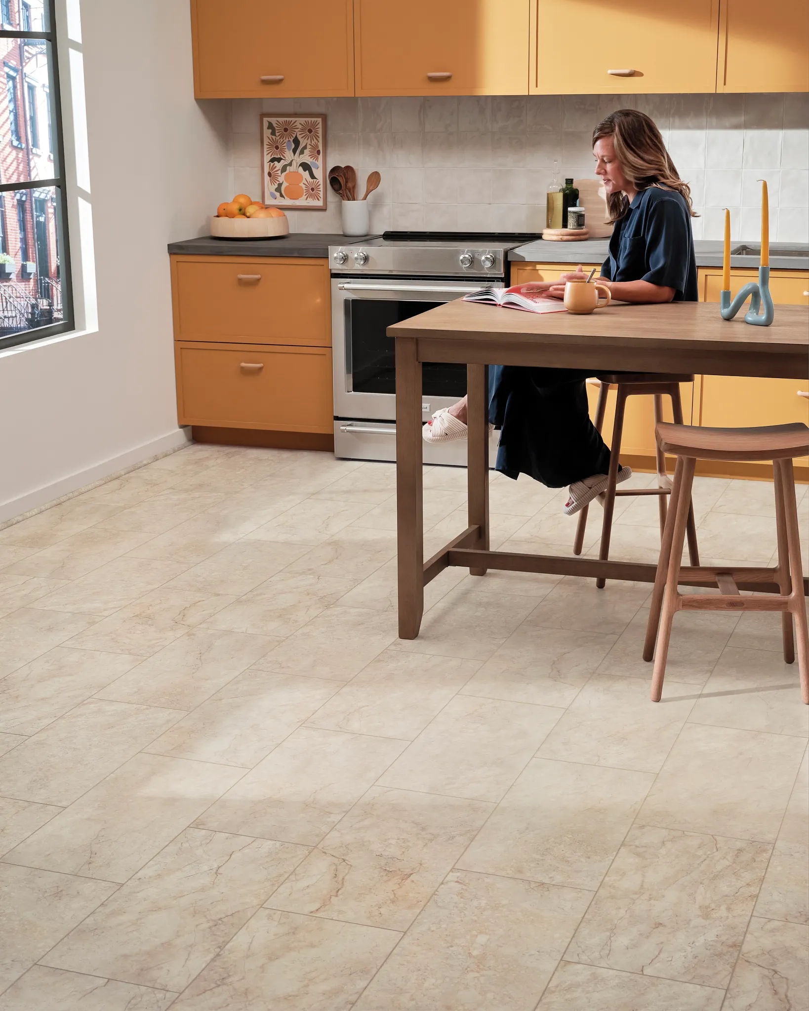 Modern kitchen with Coretec Residential WPC luxury vinyl tile flooring in beige tones, featuring 24x12 inch tiles