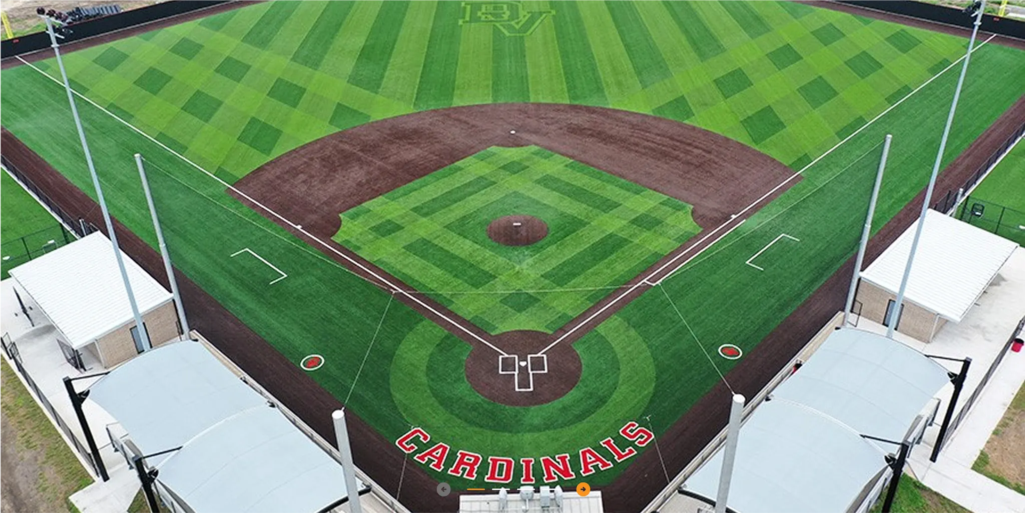 Aerial view of a baseball field with artificial turf featuring green and brown sections