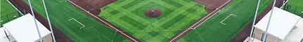Aerial view of a baseball field with artificial turf featuring green and brown sections