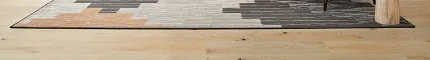 Contemporary office design with light wood flooring and minimalist decor Modern office space with light wood flooring, featuring a desk, chair, and a cactus plant