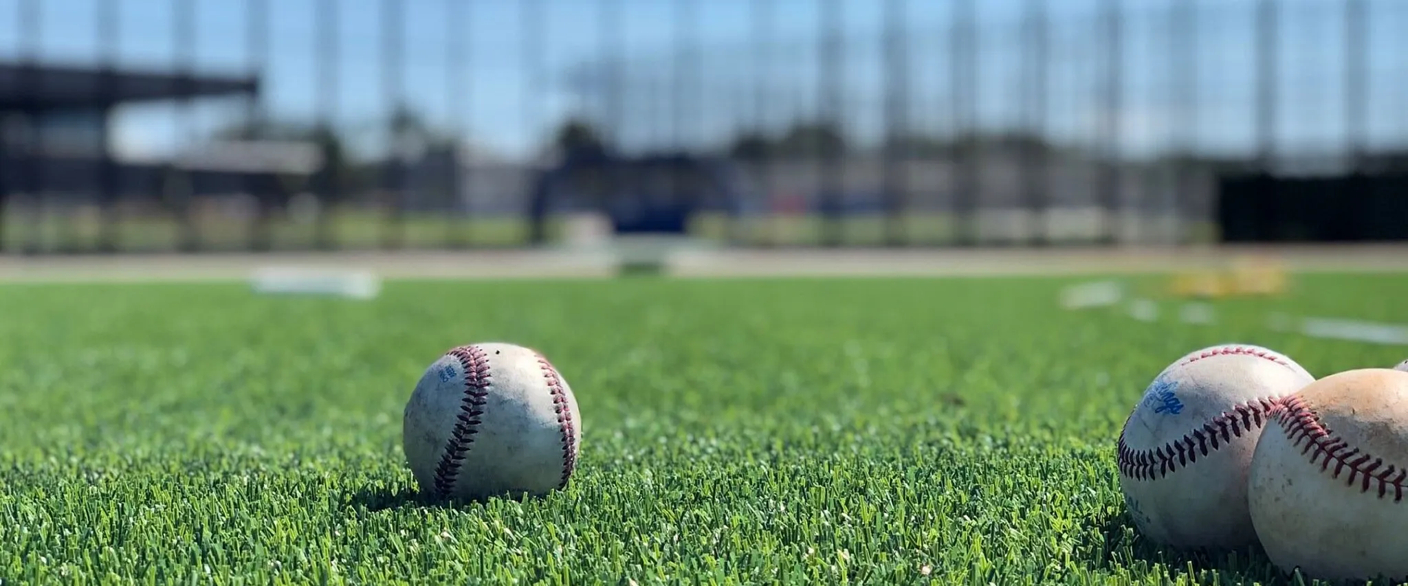 Baseballs on artificial turf in a sports field