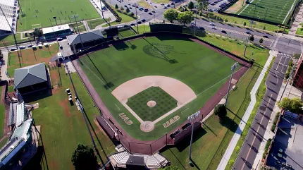 Baseball stadium with artificial turf field aerial view Aerial view of a baseball stadium with artificial turf field