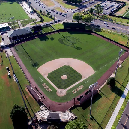 Baseball stadium with artificial turf field aerial view Aerial view of a baseball stadium with artificial turf field