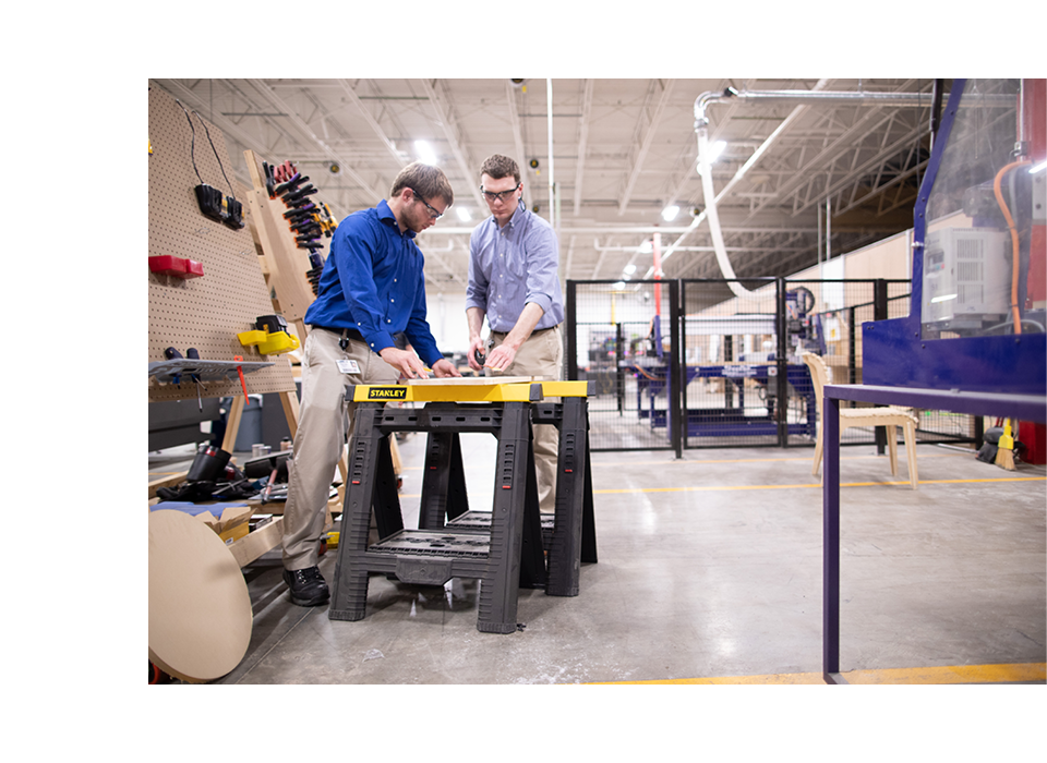 2 operators inspecting products in a plant