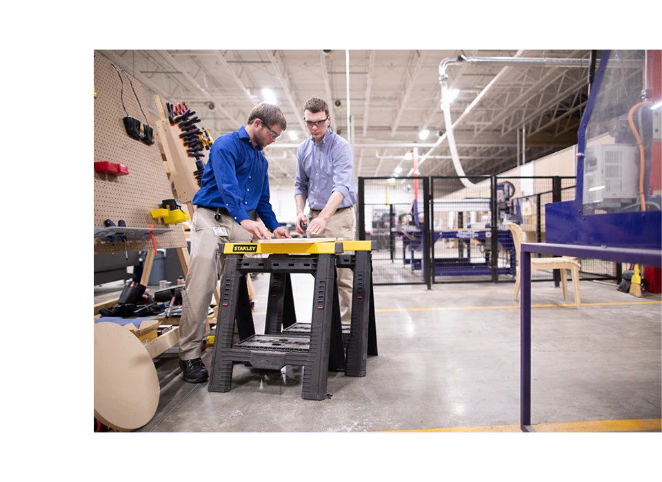 2 operators inspecting products in a plant
