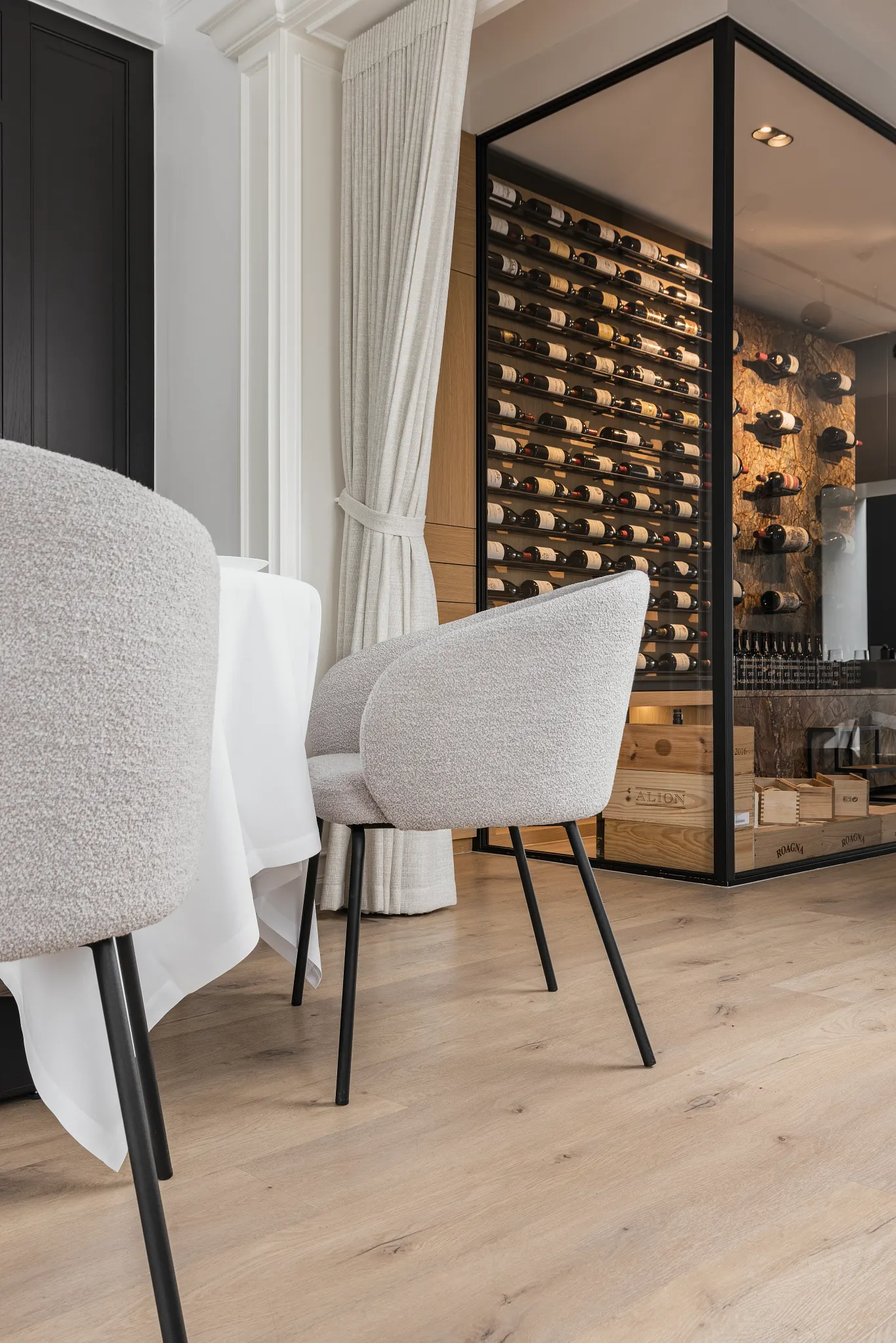 Modern dining room with wood look vinyl flooring and wine display