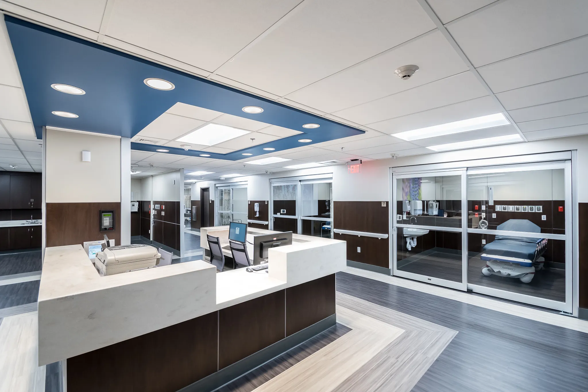 Modern healthcare facility with sleek reception area and commercial flooring