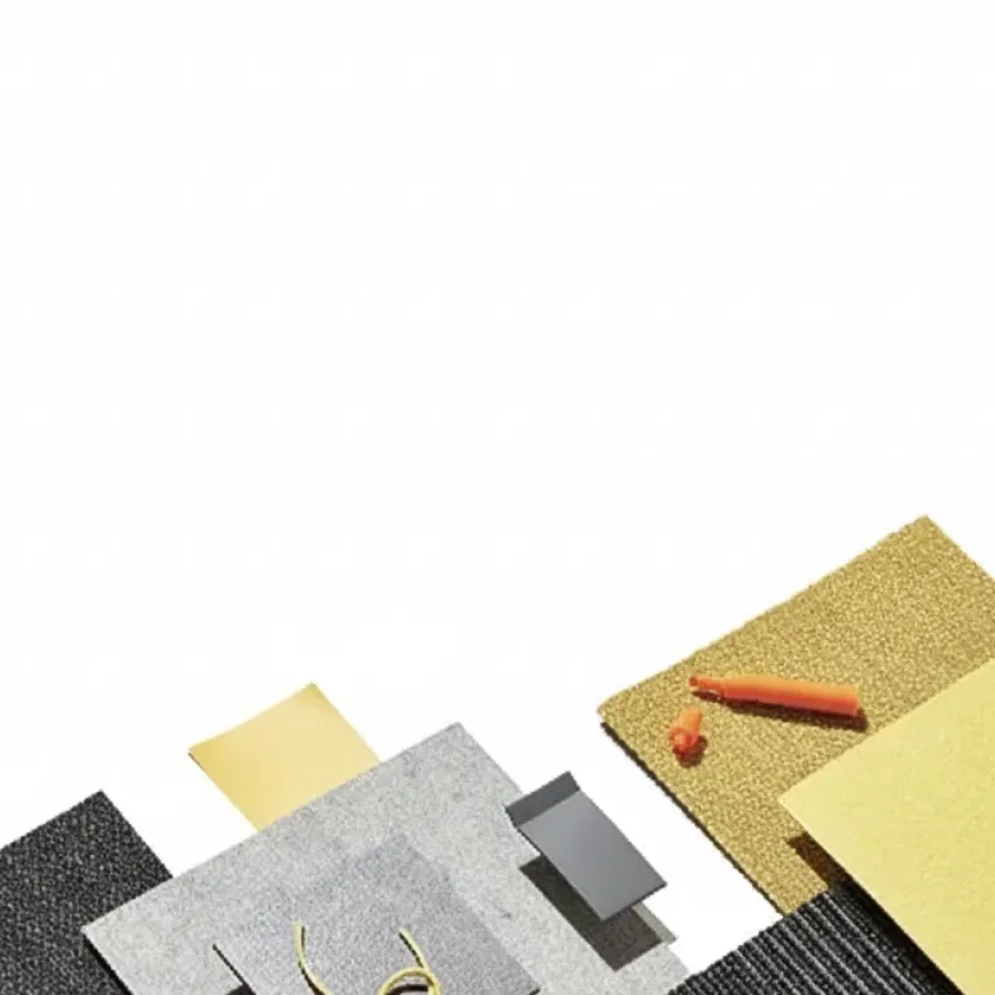 Assorted carpet swatches in black, gray, and gold