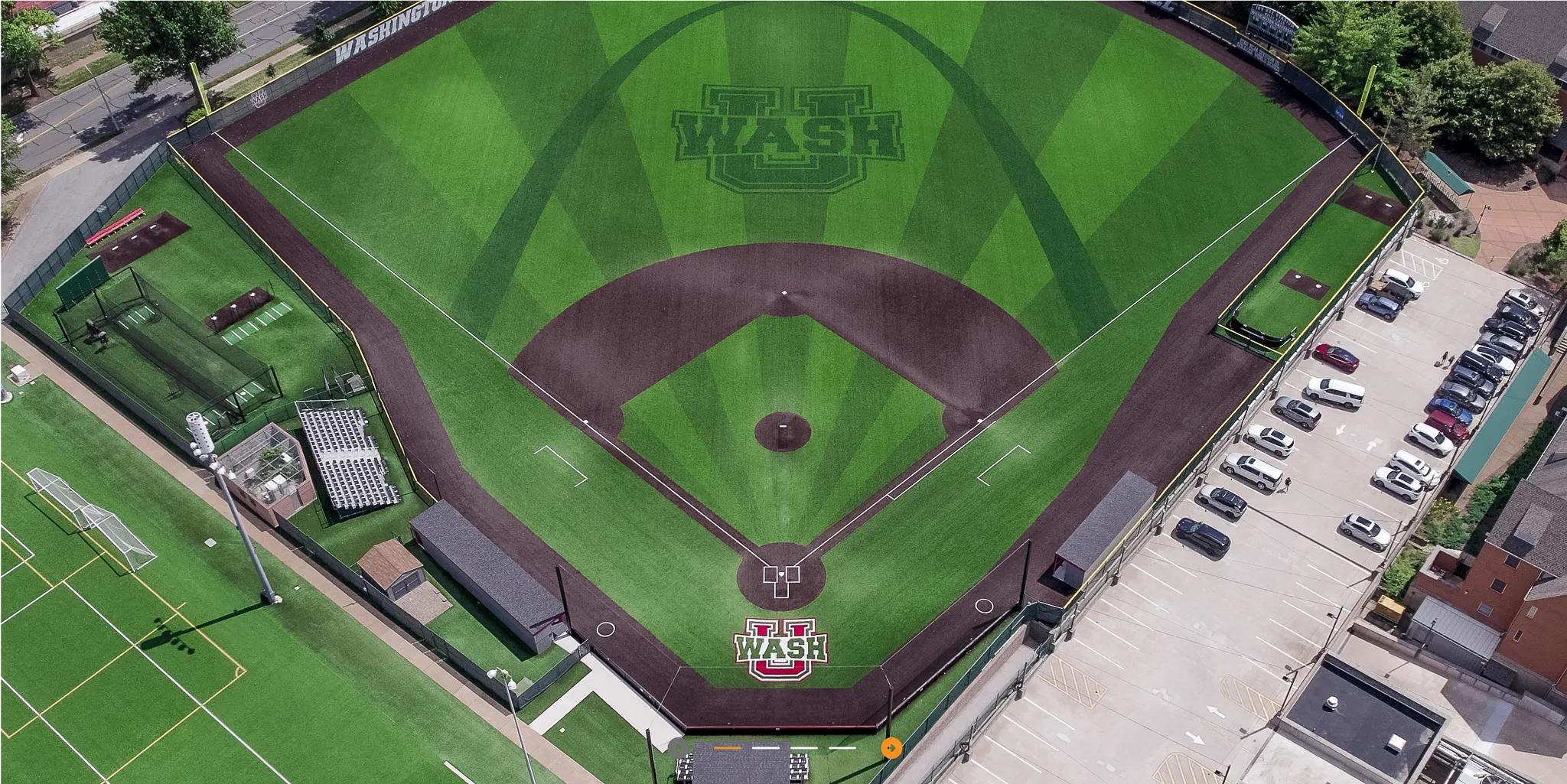 Aerial view of a baseball field with artificial turf featuring Washington University logo