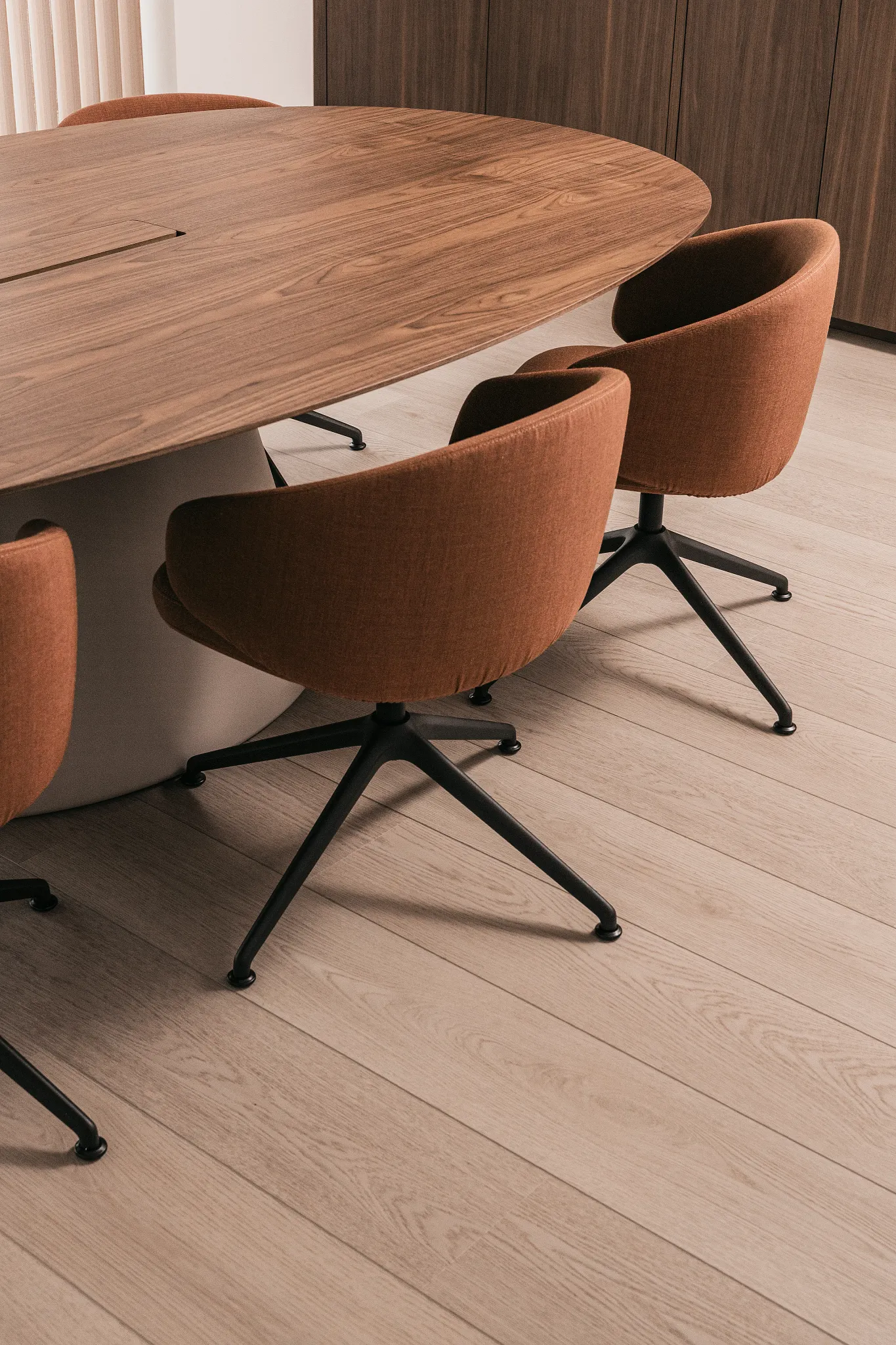 Modern dining room with wood look vinyl flooring and stylish chairs
