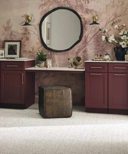 Synthetic Carpet in Stylish Room with Burgundy Cabinets and Decor Elegant room with synthetic carpet flooring, burgundy cabinets, and decorative elements