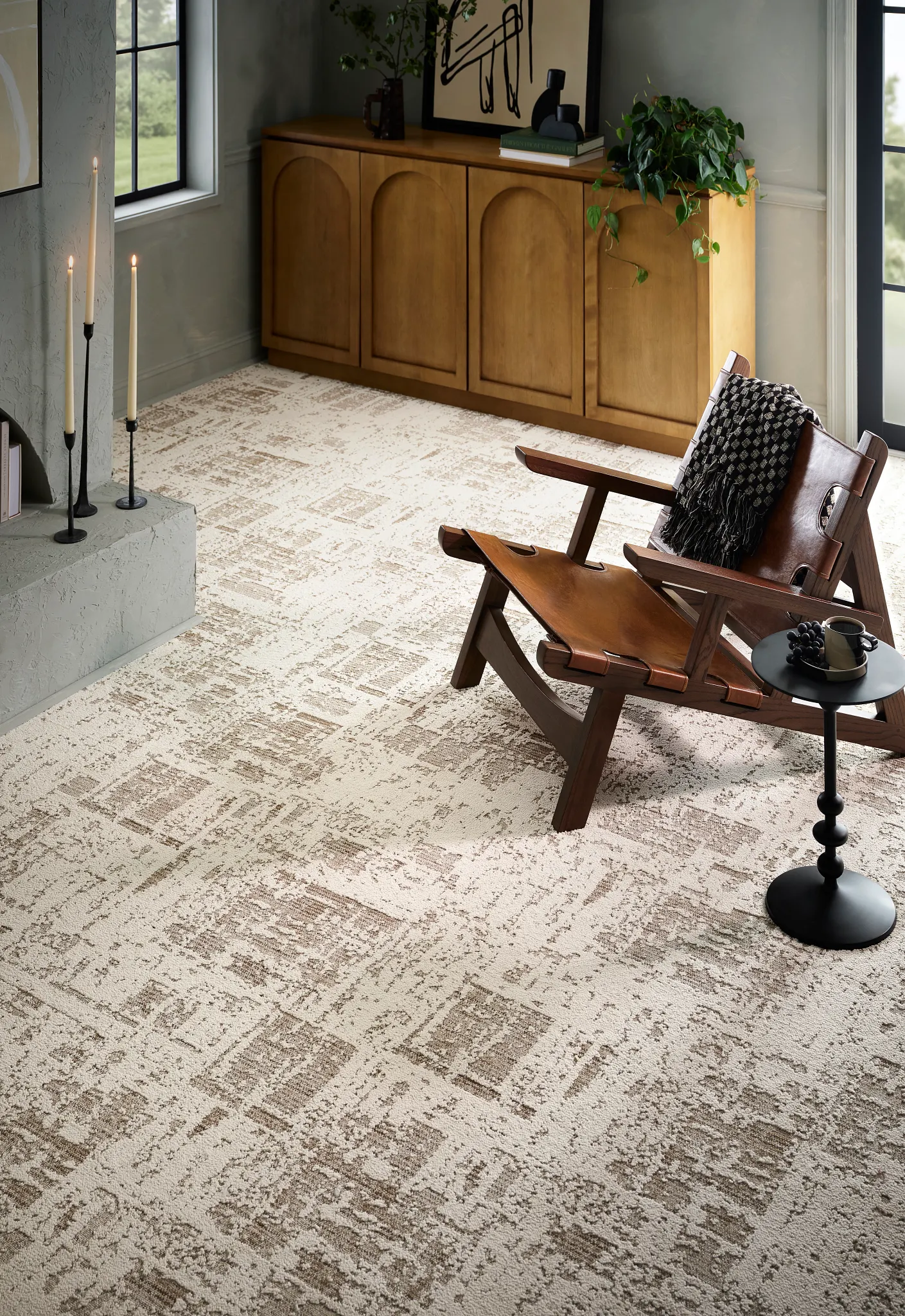 Elegant broadloom carpet in a modern living room with beige and brown geometric patterns