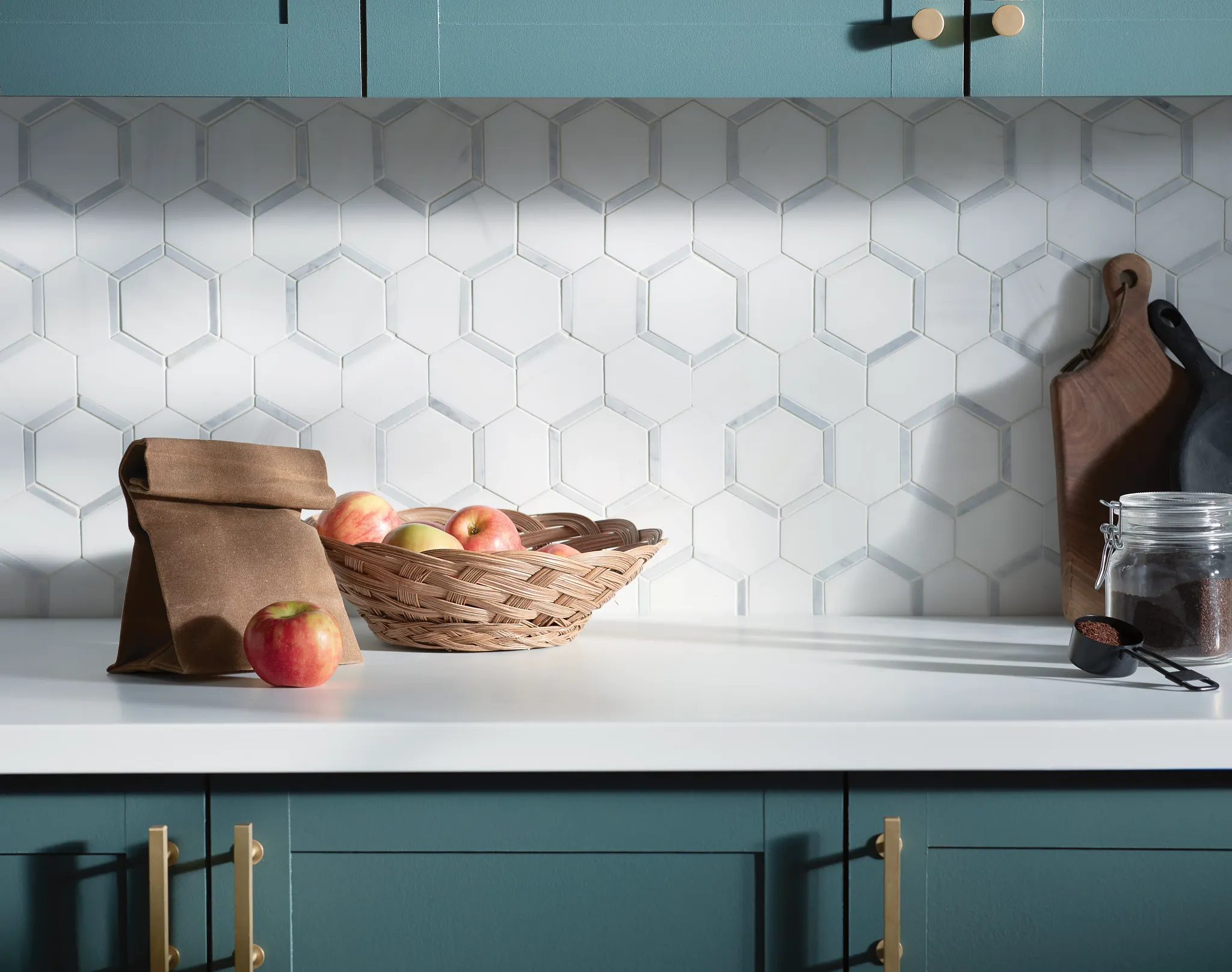 Modern kitchen with white hexagonal tile backsplash and teal cabinets