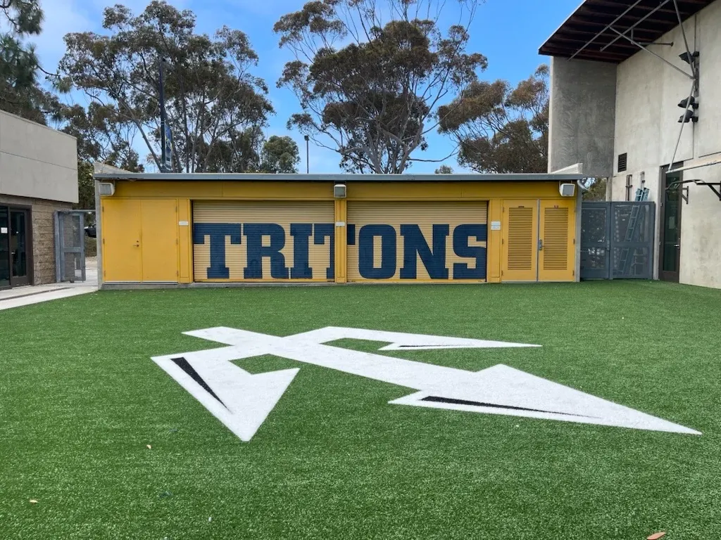 Outdoor artificial turf with Tritons logo