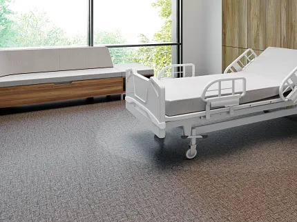 Healthcare Facility Room with Commercial Heterogeneous Sheet Vinyl Flooring Healthcare facility room with hospital bed and sofa, featuring commercial heterogeneous sheet vinyl flooring with fiberglass construction, dimensions 68.58x6.56 ft