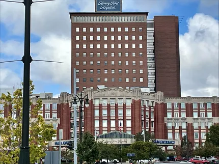 Henry Ford Hospital exterior view - Healthcare Facility. Exterior view of Henry Ford Hospital building with red brick facade and multiple windows, Healthcare Facility building exterior view.
