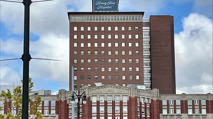Henry Ford Hospital exterior view - Healthcare Facility. Exterior view of Henry Ford Hospital building with red brick facade and multiple windows, Healthcare Facility building exterior view.