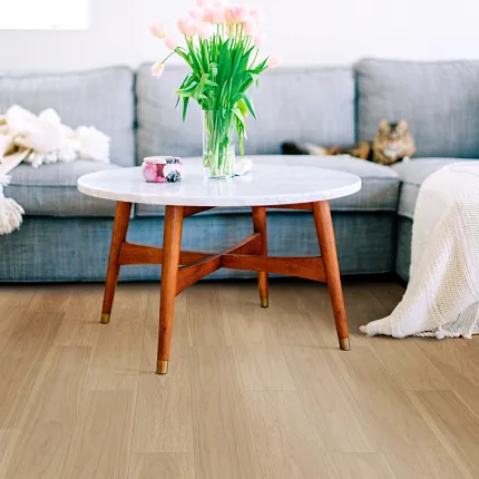 Light Wood Look Luxury Vinyl Plank Flooring in Modern Living Room Modern living room with light wood look luxury vinyl plank flooring, gray sofa, and wooden coffee table
