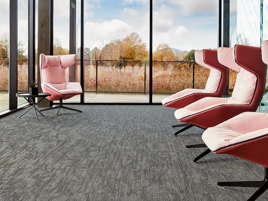 Contemporary office interior with gray commercial carpet tile flooring and pink seating Hub in Team