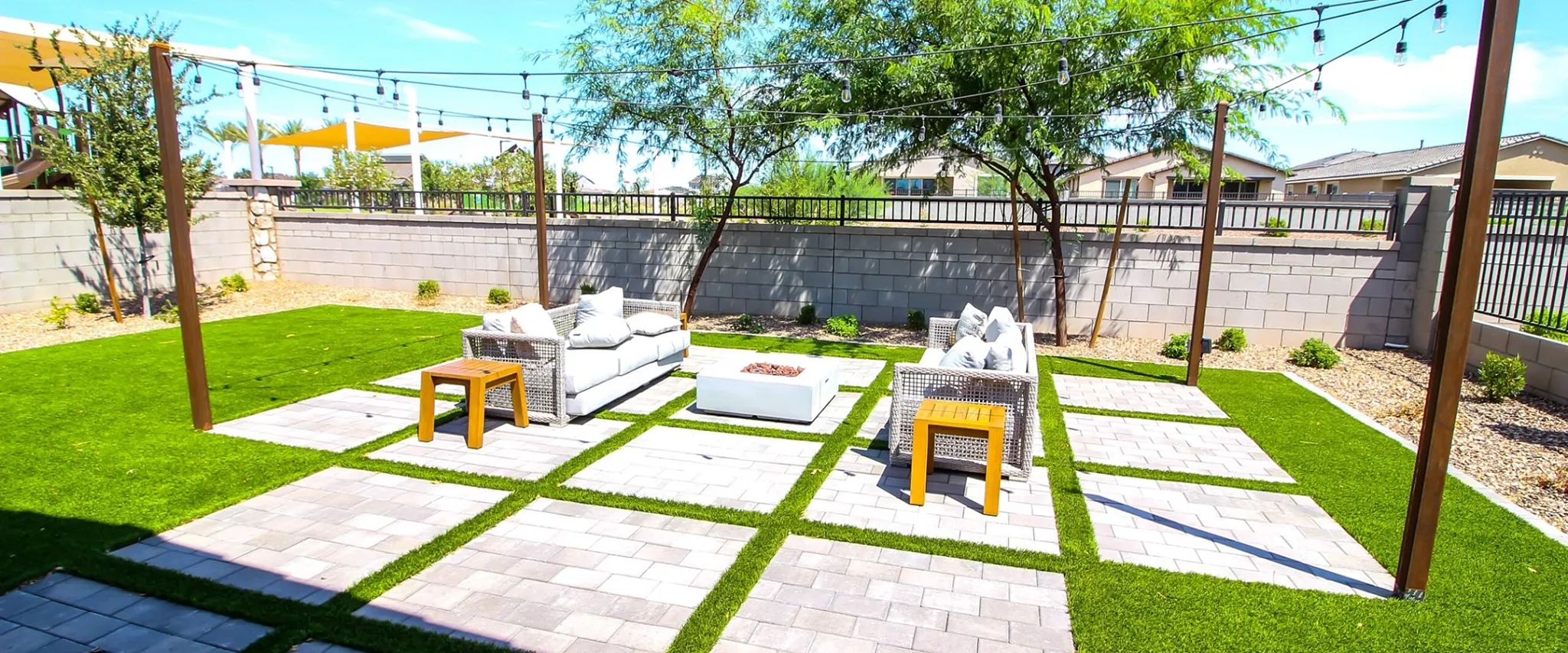 Outdoor patio with modern furniture and paver flooring