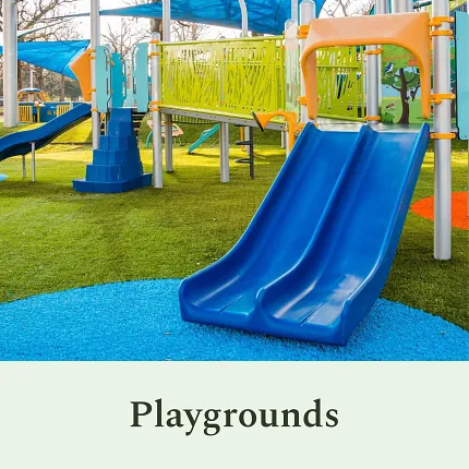 Vibrant playground design for outdoor fun Colorful playground with blue slide and green turf