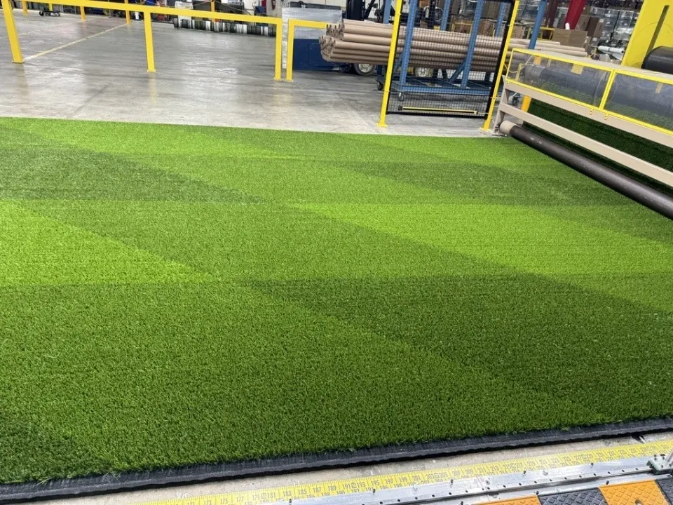 Green artificial turf in a manufacturing facility