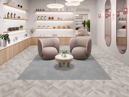 Espacio comercial contemporáneo con piso en patrón de espiga y decoración moderna. Espacio comercial moderno con piso de madera clara en patrón de espiga y mobiliario contemporáneo.