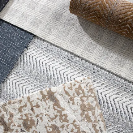 Explore Our Diverse Carpet Patterns in Blue Close-up view of various carpet swatches featuring patterns in blue