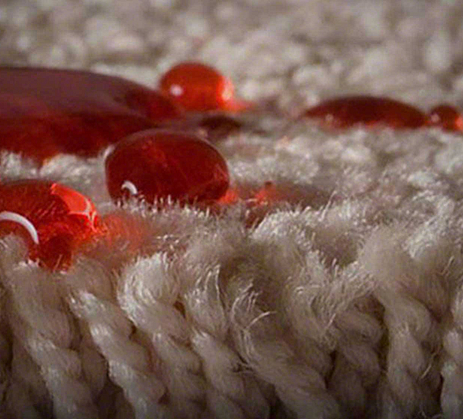 Close-up on drops on carpet fibers