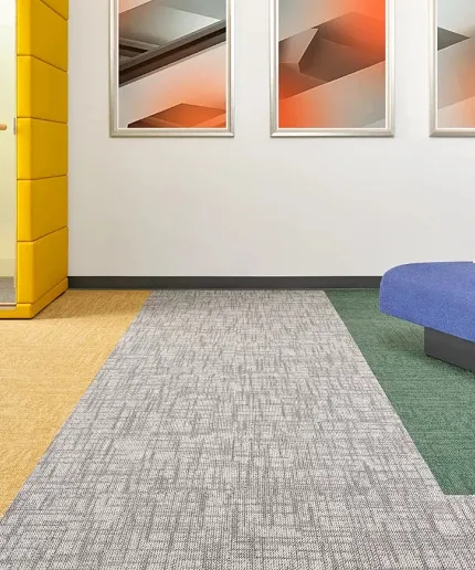 Stylish carpet tile design for contemporary workspaces Modern office space with yellow, gray, and green carpet tiles