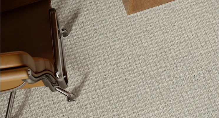 Beige carpet flooring with office chair