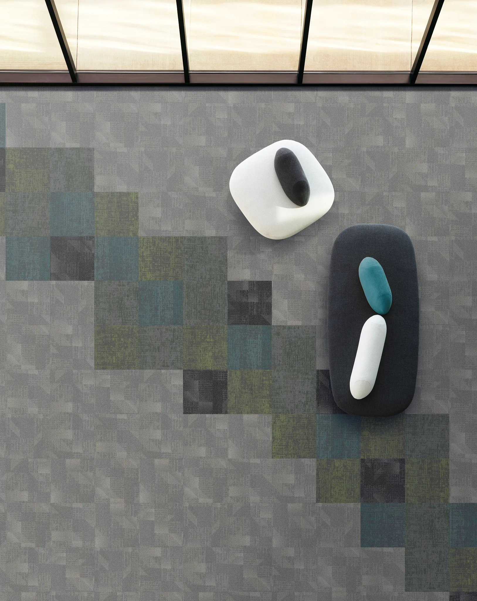 Modern carpet tile in shades of gray, green, and blue in a contemporary setting