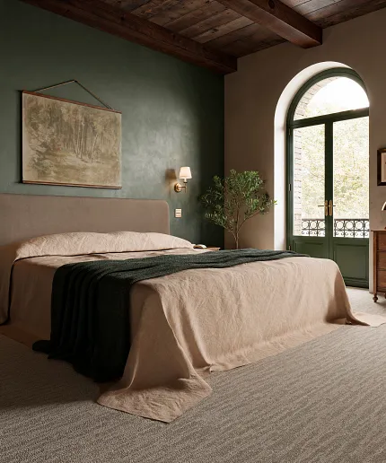 Cozy bedroom interior with beige carpet flooring and green accents Elegant bedroom with green walls, large windows, and beige carpet flooring